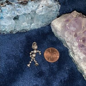 Silver dancing man charm